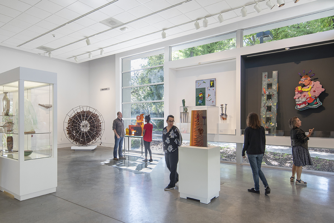interior view of palley pavillion with people looking at artwork