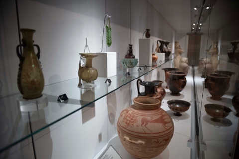 image of ancient Greek and Roman vases in a glass case