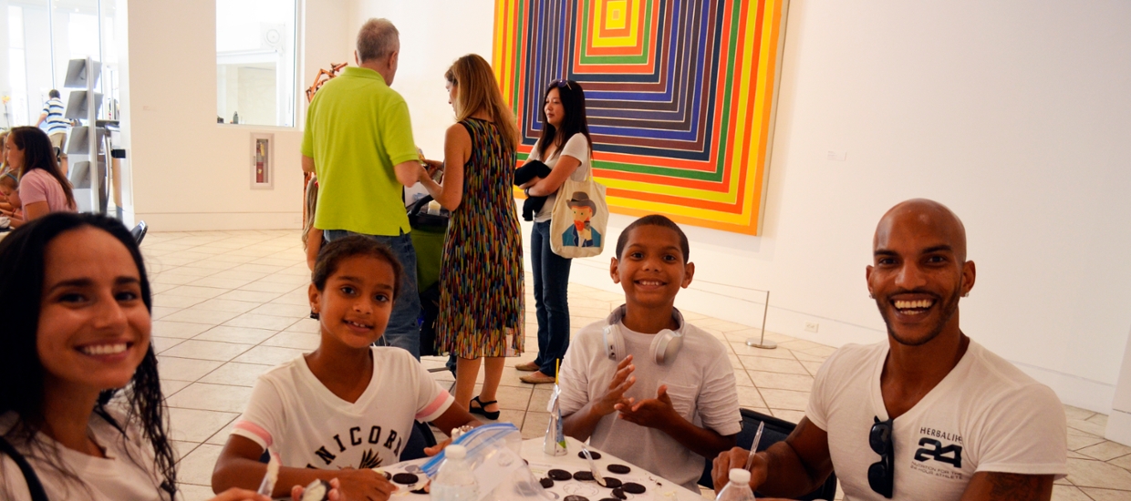 image of family at a table doing art