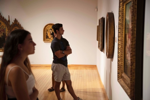 college students looking at paintings