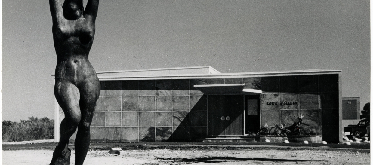 black and white photo of original lowe art gallery with figurative statue in the foreground