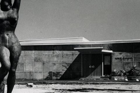 black and white photo of original lowe art gallery with figurative statue in the foreground