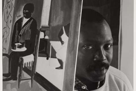 photograph of artist jacob lawrence by Arnold Newman, black and white in artist studio