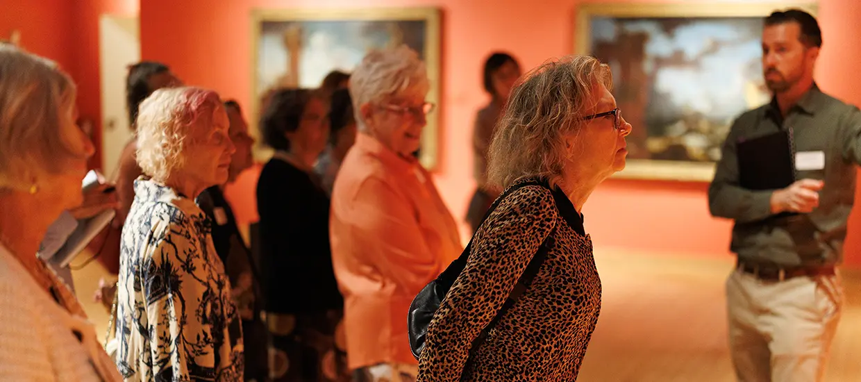 People taking a tour of the Lowe with a Volunteer