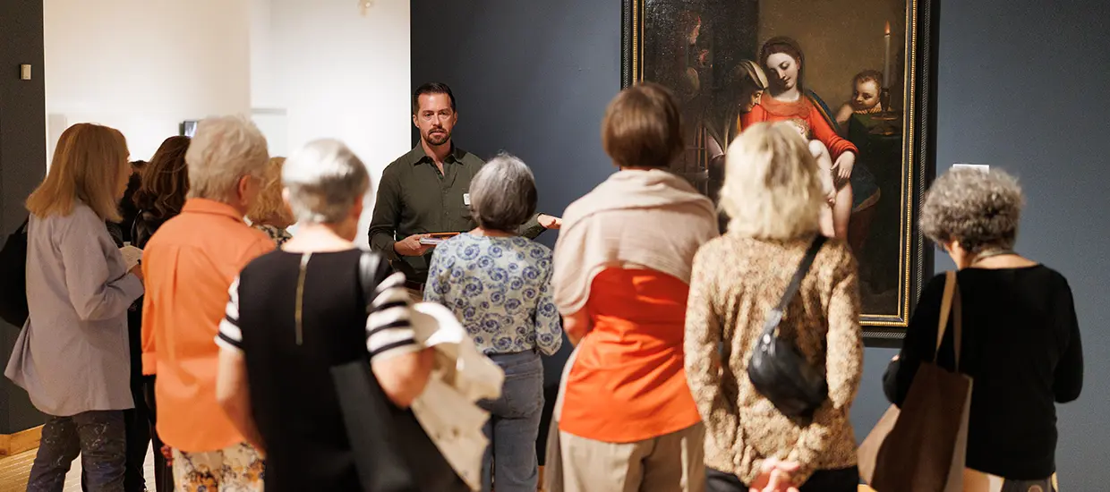 People taking a tour of the Lowe with a Volunteer