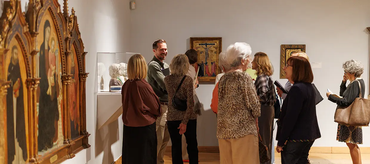People taking a tour of the Lowe with a Volunteer