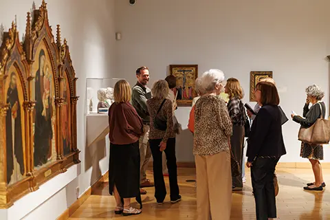 People taking a tour of the Lowe with a Volunteer