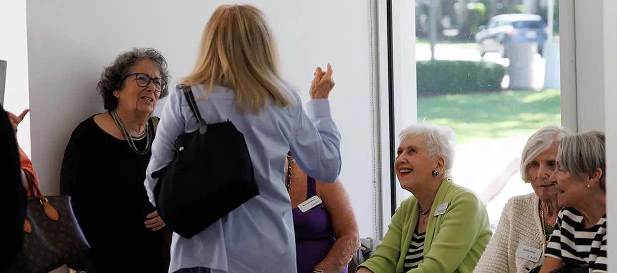 People taking a tour of the Lowe with a Volunteer