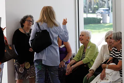 People taking a tour of the Lowe with a Volunteer